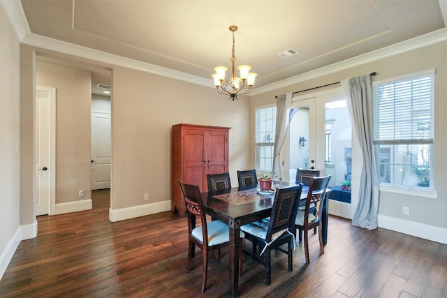 6919 Champion Trl, Katy, TX 77493 - dining area featuring a chandelier, dark wood-type flooring, healthy amount of natural light, and crown molding
