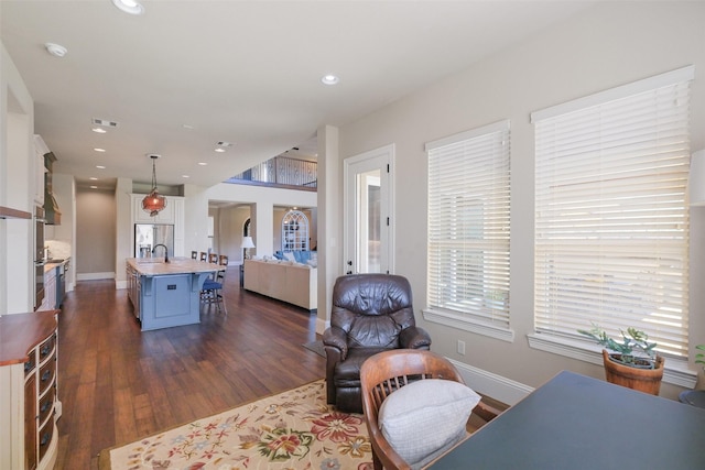 6919 Champion Trl, Katy, TX 77493 - living area with baseboards, dark wood-style floors, and recessed lighting