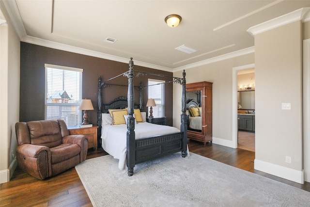 6919 Champion Trl, Katy, TX 77493 - bedroom featuring dark wood-style flooring, ornamental molding, and baseboards