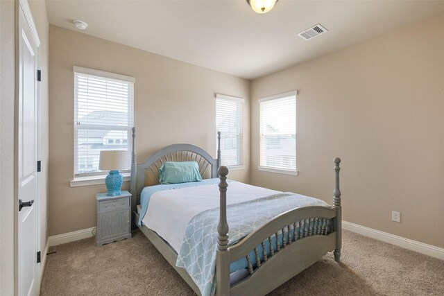 6919 Champion Trl, Katy, TX 77493 - bedroom with light colored carpet and baseboards