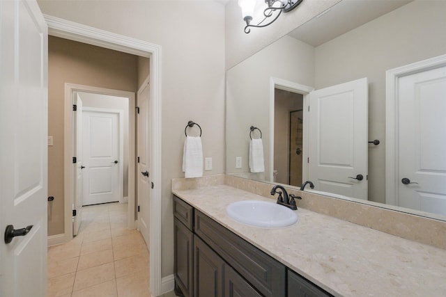 6919 Champion Trl, Katy, TX 77493 - bathroom with tile patterned floors, vanity, and baseboards