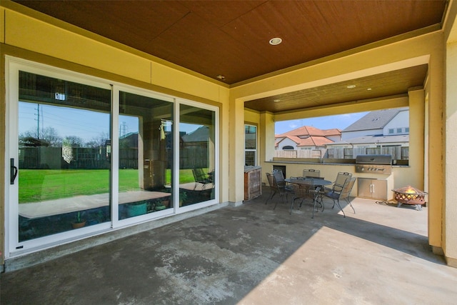 6919 Champion Trl, Katy, TX 77493 - view of patio / terrace with outdoor dining space, fence, and a grill