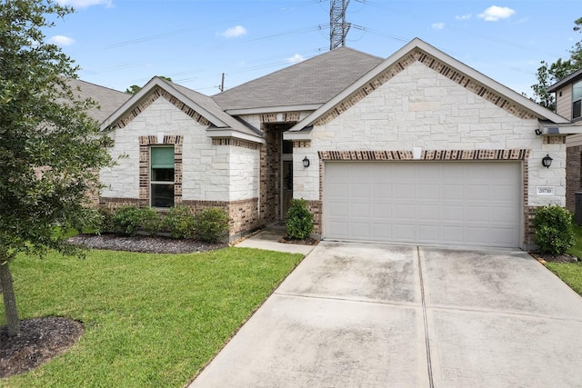 20710 Kings Timber Trl, Humble, TX 77346 - french country home with stone siding, a front yard, and roof with shingles