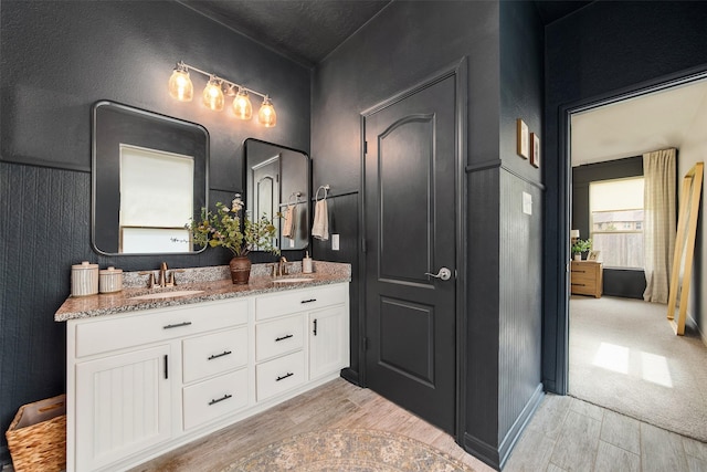 20710 Kings Timber Trl, Humble, TX 77346 - bathroom featuring wood finished floors and double vanity