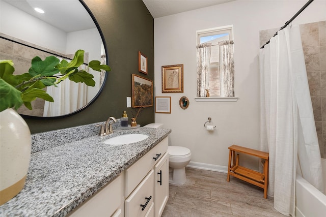 20710 Kings Timber Trl, Humble, TX 77346 - bathroom featuring toilet, vanity, baseboards, wood finished floors, and shower / bath combination with curtain