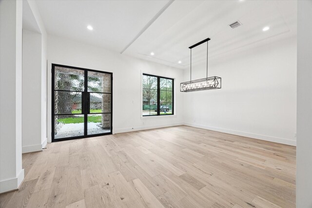 4706 Waring St, Houston, TX 77027 - unfurnished dining area with light wood-type flooring, recessed lighting, baseboards, and a chandelier