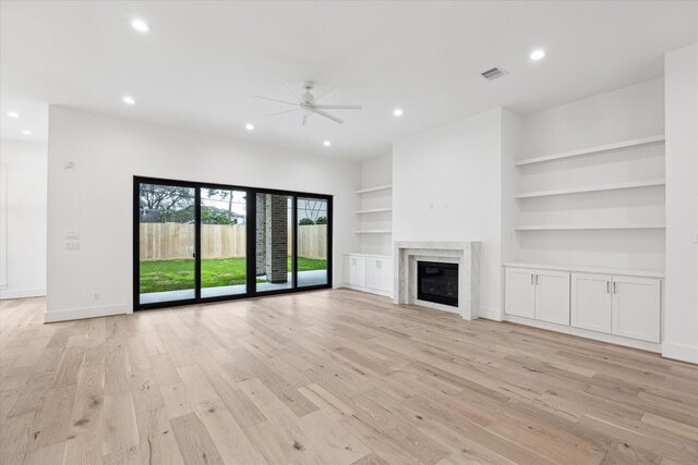 4706 Waring St, Houston, TX 77027 - unfurnished living room with ceiling fan, recessed lighting, light wood-type flooring, a fireplace, and baseboards