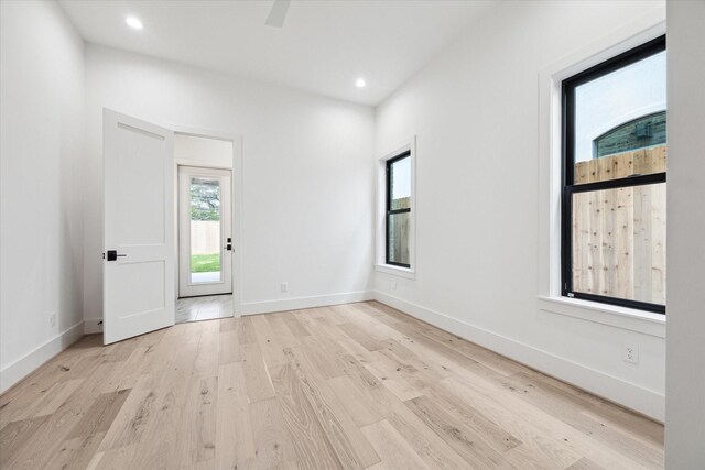 4706 Waring St, Houston, TX 77027 - empty room featuring healthy amount of natural light, light wood-type flooring, recessed lighting, and baseboards