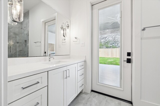 4706 Waring St, Houston, TX 77027 - bathroom featuring a shower stall, vanity, and marble finish floors