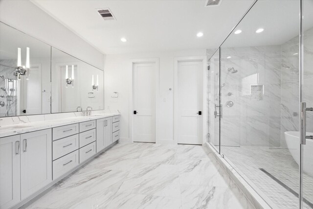 4706 Waring St, Houston, TX 77027 - full bath featuring a marble finish shower, double vanity, recessed lighting, and a soaking tub