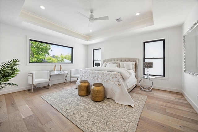 4706 Waring St, Houston, TX 77027 - bedroom with a raised ceiling, light wood-style flooring, baseboards, ceiling fan, and recessed lighting