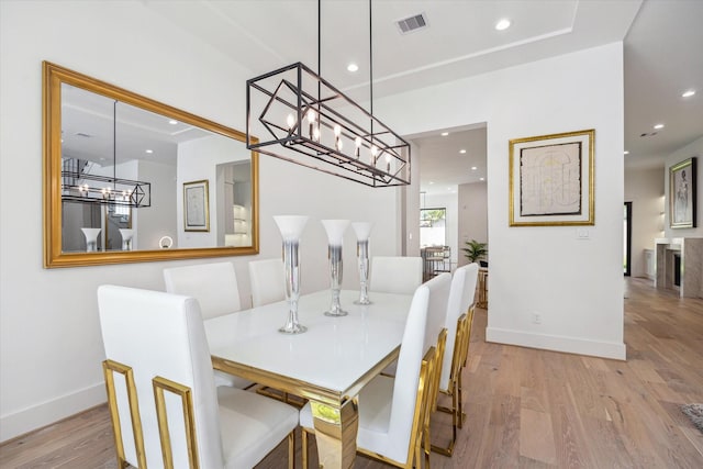 4706 Waring St, Houston, TX 77027 - dining space with recessed lighting, wood finished floors, baseboards, and a chandelier