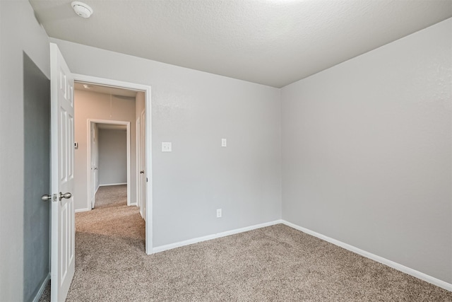 12750 Tullich Ln, Humble, TX 77346 - carpeted empty room featuring attic access, a smoke detector, and baseboards