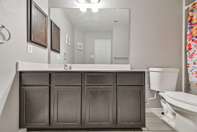12750 Tullich Ln, Humble, TX 77346 - full bath with toilet, vanity, tile patterned flooring, and a textured wall