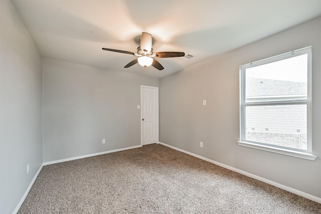 12750 Tullich Ln, Humble, TX 77346 - carpeted empty room with plenty of natural light, ceiling fan, and baseboards