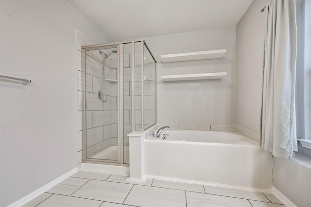 12750 Tullich Ln, Humble, TX 77346 - full bathroom with a bath, a shower stall, tile patterned floors, and baseboards