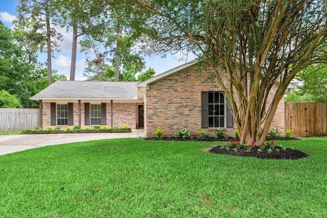 ranch-style house with brick siding and concrete driveway