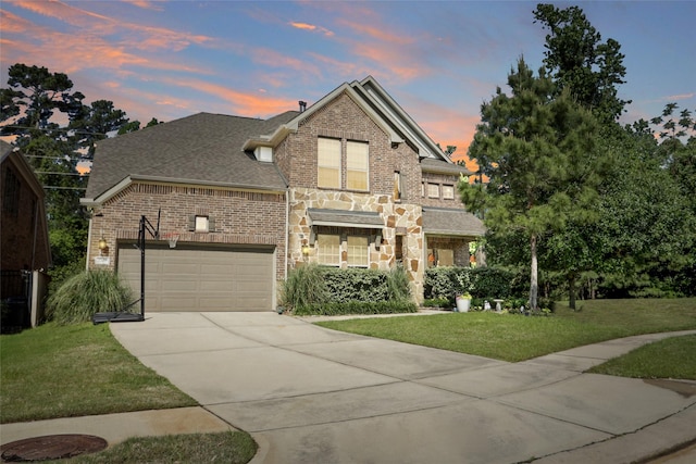 27163 Allenby Park Dr, Magnolia, TX 77354 - view of front of property featuring concrete driveway, a front yard, a garage, and brick siding