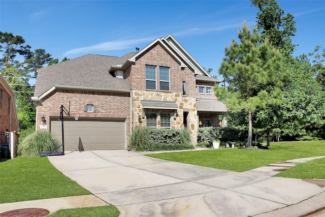 27163 Allenby Park Dr, Magnolia, TX 77354 - view of front of home with driveway, brick siding, a front yard, a garage, and stone siding