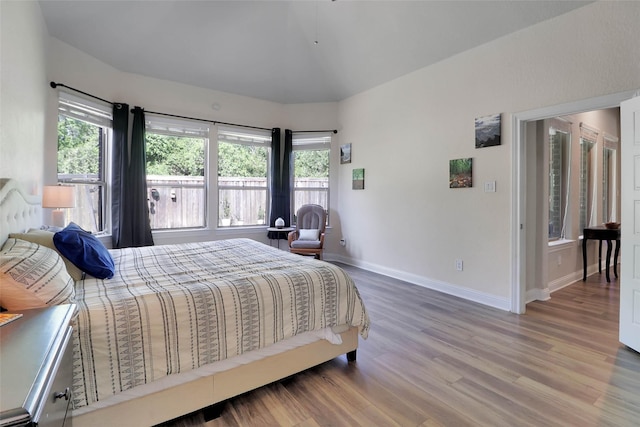 27163 Allenby Park Dr, Magnolia, TX 77354 - bedroom featuring multiple windows, baseboards, and wood finished floors