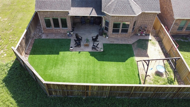 27163 Allenby Park Dr, Magnolia, TX 77354 - rear view of house with brick siding, a patio area, and roof with shingles