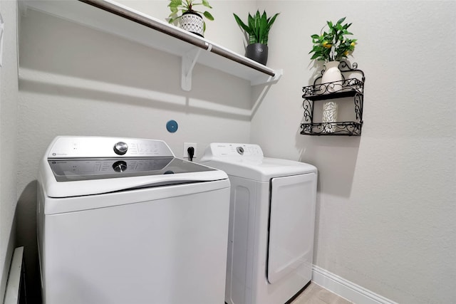 27163 Allenby Park Dr, Magnolia, TX 77354 - laundry room with washer and dryer and baseboards