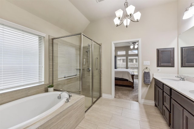 19914 Philippa Hills Trl, Cypress, TX 77433 - bathroom featuring healthy amount of natural light, a chandelier, a bath, a stall shower, and vaulted ceiling