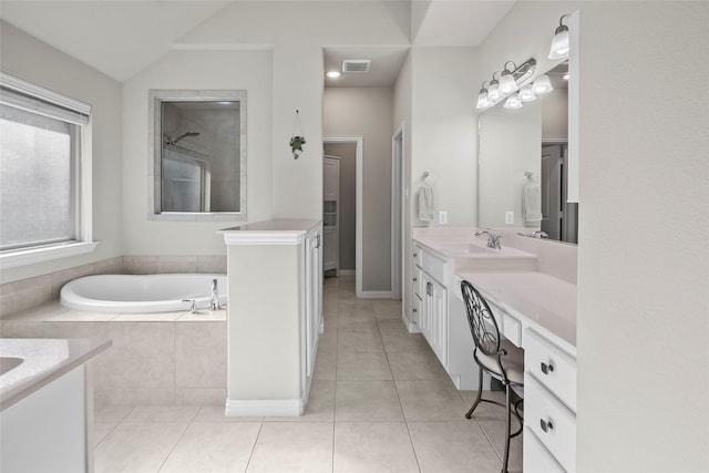 17214 Sequoia Kings Dr, Humble, TX 77346 - bathroom featuring vanity, a bath, tile patterned flooring, lofted ceiling, and a shower