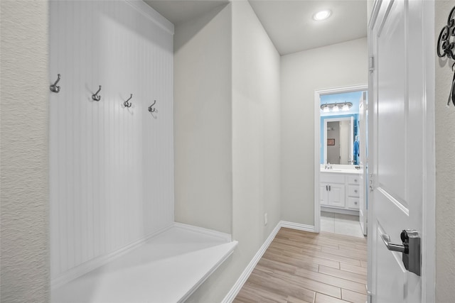 17214 Sequoia Kings Dr, Humble, TX 77346 - mudroom with light wood-style flooring and baseboards