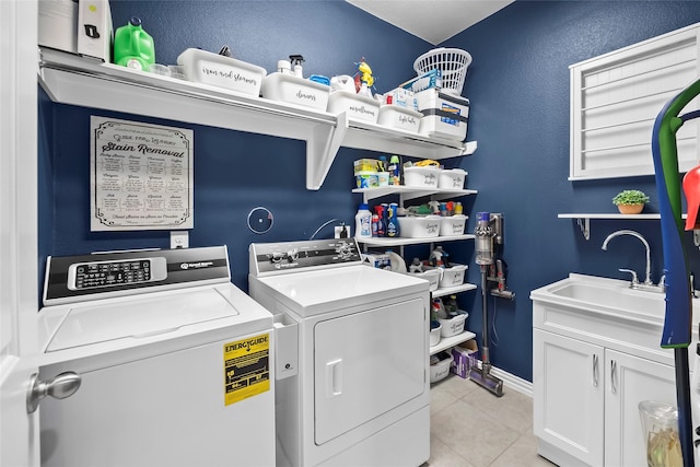 17214 Sequoia Kings Dr, Humble, TX 77346 - laundry area with independent washer and dryer, cabinet space, light tile patterned floors, and baseboards