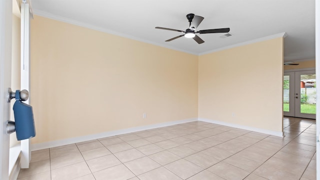 unfurnished room featuring ceiling fan, crown molding, light tile patterned floors, baseboards, and french doors