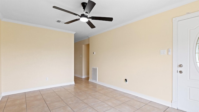 unfurnished room with ornamental molding, ceiling fan, light tile patterned flooring, and baseboards