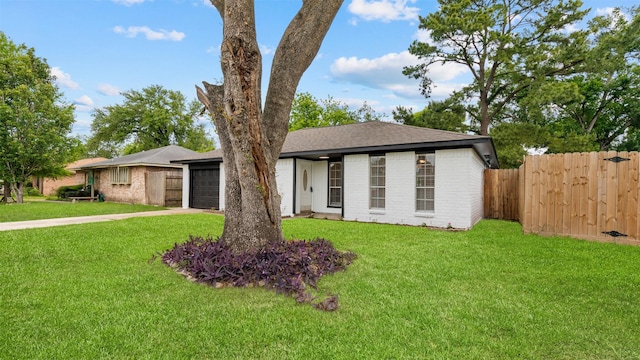 ranch-style home with a garage, driveway, a shingled roof, and brick siding