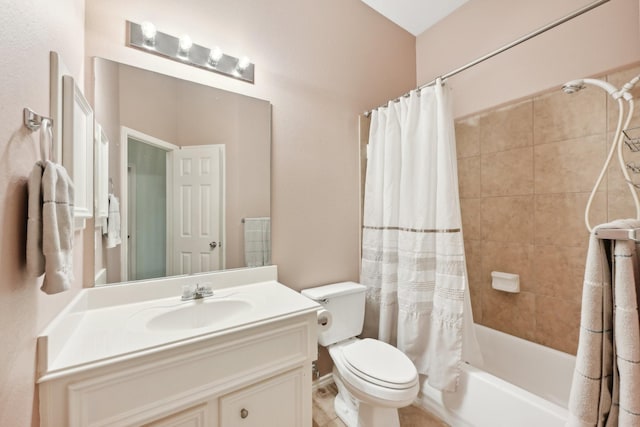 full bath with vanity, shower / bath combo, and toilet