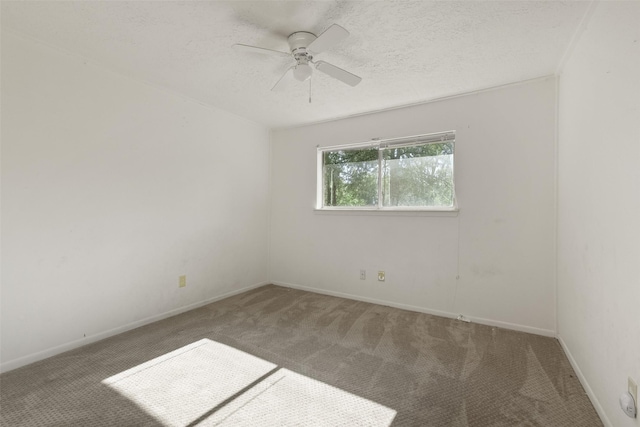 217 Lazy Ln, Conroe, TX 77301 - carpeted spare room with a ceiling fan, baseboards, and a textured ceiling