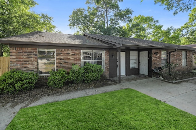 217 Lazy Ln, Conroe, TX 77301 - ranch-style home featuring brick siding and a shingled roof