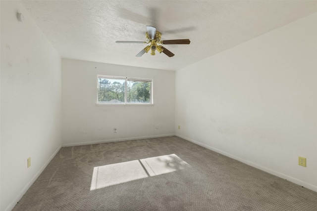 217 Lazy Ln, Conroe, TX 77301 - spare room featuring carpet, a ceiling fan, and baseboards