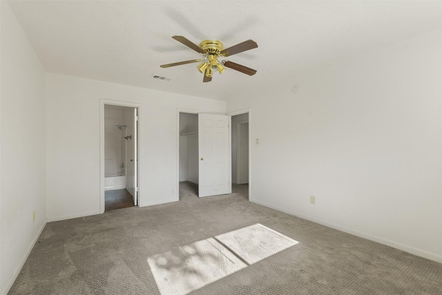217 Lazy Ln, Conroe, TX 77301 - unfurnished bedroom featuring carpet floors, a closet, and baseboards