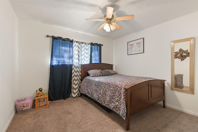 217 Lazy Ln, Conroe, TX 77301 - bedroom featuring carpet floors, a ceiling fan, and baseboards