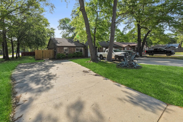 217 Lazy Ln, Conroe, TX 77301 - single story home with driveway and brick siding