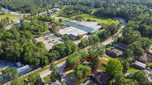 217 Lazy Ln, Conroe, TX 77301 - view of property location featuring property boundaries highlighted and a heavily wooded area