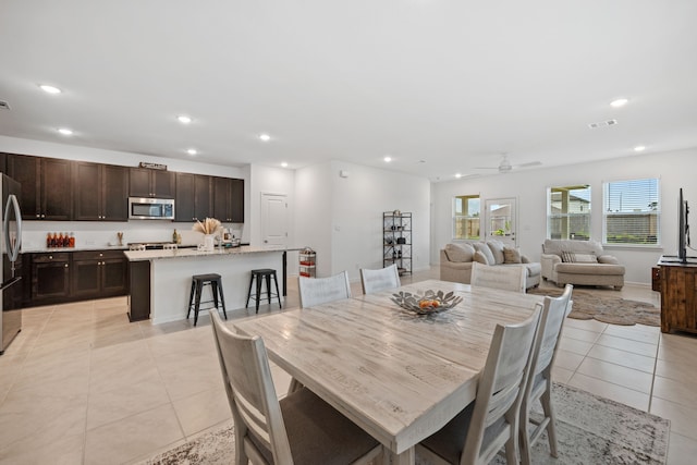 dining space with light tile patterned floors, recessed lighting, and ceiling fan