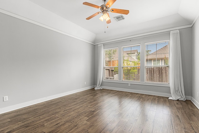 spare room with vaulted ceiling, dark wood-style floors, ceiling fan, and baseboards