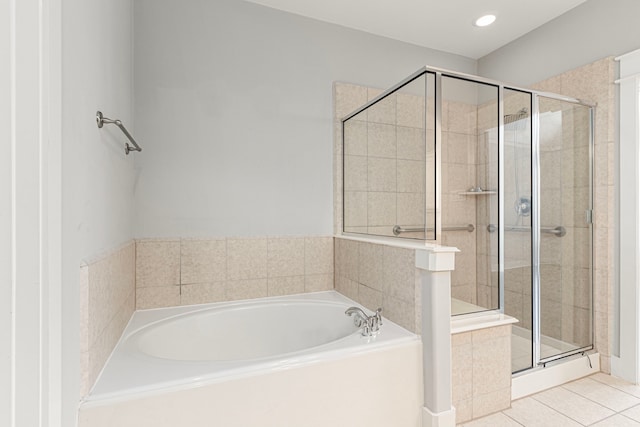 full bathroom featuring a stall shower, tile patterned flooring, and a bath