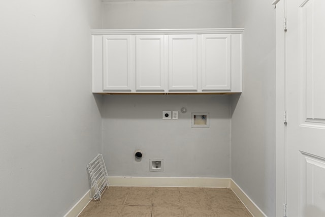 laundry area featuring electric dryer hookup, washer hookup, baseboards, cabinet space, and hookup for a gas dryer