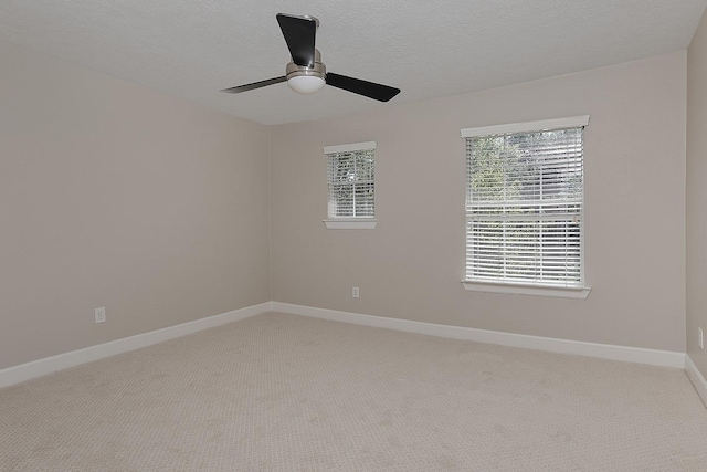 158 Hansom Trail St, The Woodlands, TX 77382 - spare room featuring light carpet, baseboards, ceiling fan, and a textured ceiling