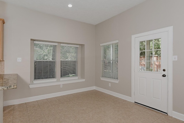 158 Hansom Trail St, The Woodlands, TX 77382 - entryway with baseboards and light tile patterned flooring