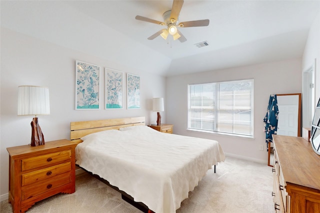 bedroom featuring light colored carpet, baseboards, ceiling fan, and vaulted ceiling