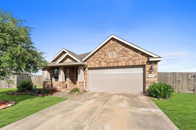 2043 Plum Rose Ln, Richmond, TX 77469 - view of front facade with brick siding, a garage, and concrete driveway