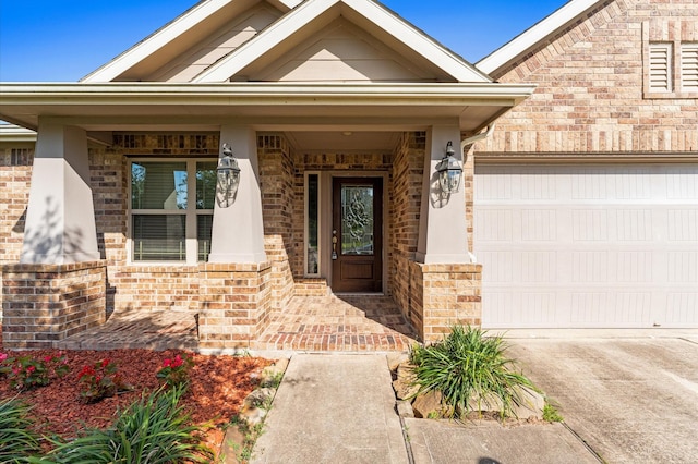 2043 Plum Rose Ln, Richmond, TX 77469 - view of exterior entry with a porch, concrete driveway, and brick siding